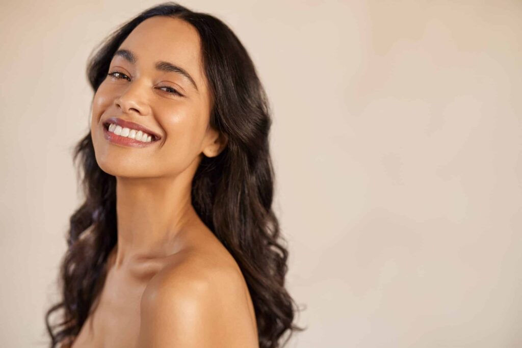 Woman with strong jawline enjoys her S-Lift facial rejuvenation results to minimize jowls