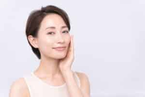 Beautiful woman with voluminous cheeks after fat transfer
