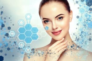 Photo of pretty woman with glowing skin surrounded by water molecules